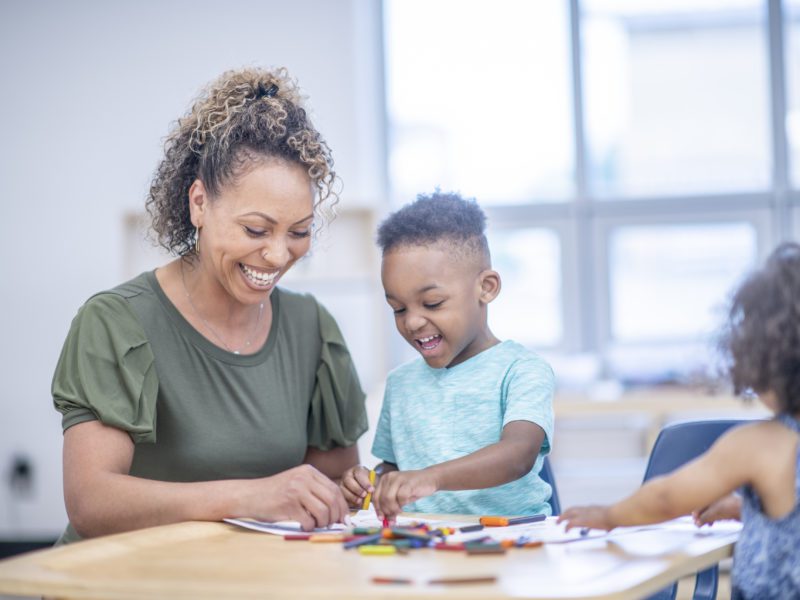A therapist and child during an ABA therapy session